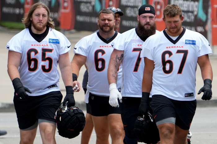 July 31, 2023; Cincinnati, OH, USA; Cincinnati Bengals guard Alex Cappa (65), Cincinnati Bengals center Ted Karras (64), Cincinnati Bengals offensive tackle Jonah Williams (73) and Cincinnati Bengals guard Cordell Volson (67) walk to the fields during NFL training camp practice, Monday, July 31, 2023, in Cincinnati. Mandatory Credit: Kareem Elgazzar-USA TODAY Sports